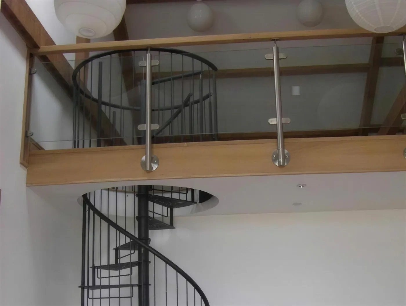 The finished oak spiral staircase and galleried landing in the completed barn conversion